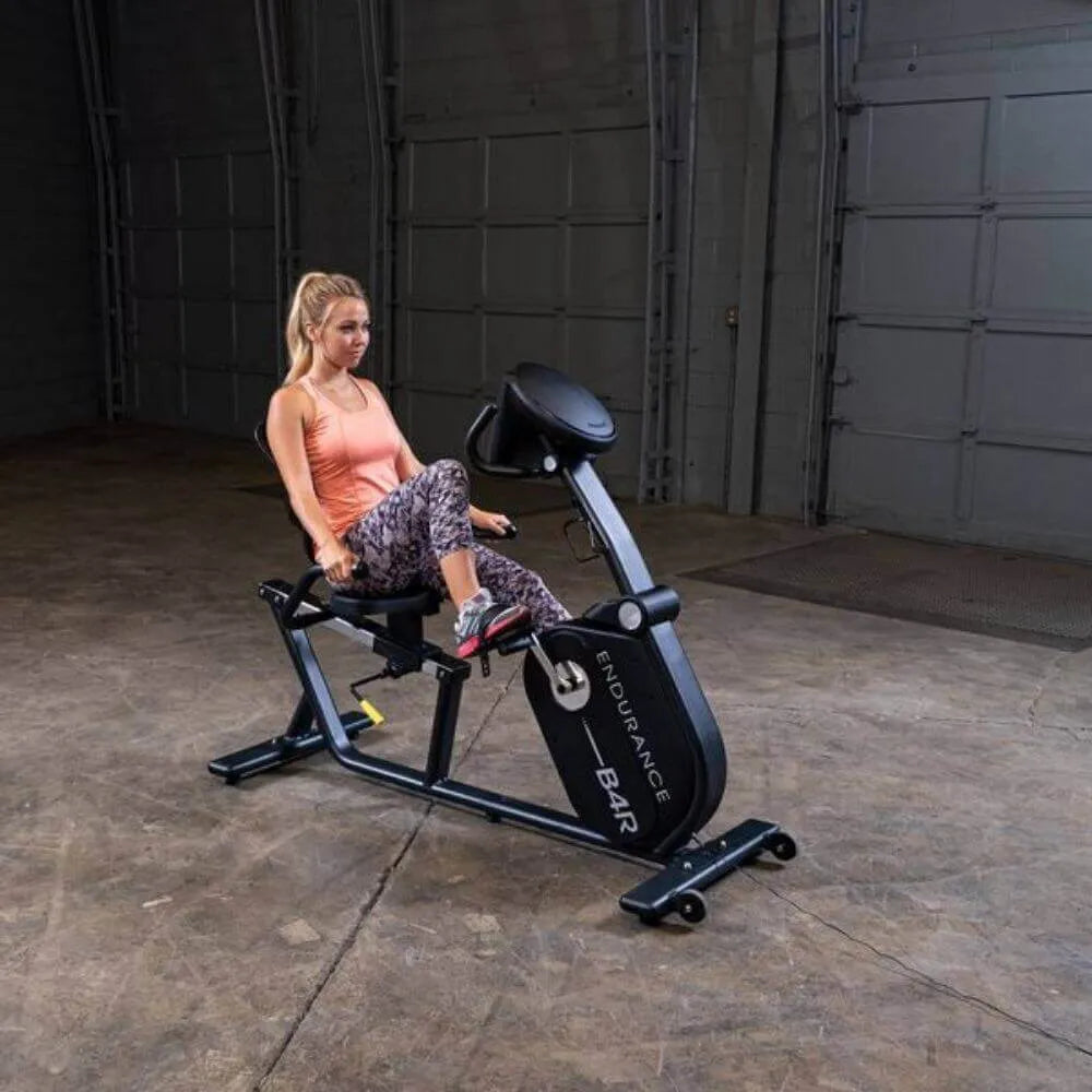 Body-Solid Endurance Recumbent Bike B4RB - front view of the product with woman using the bike