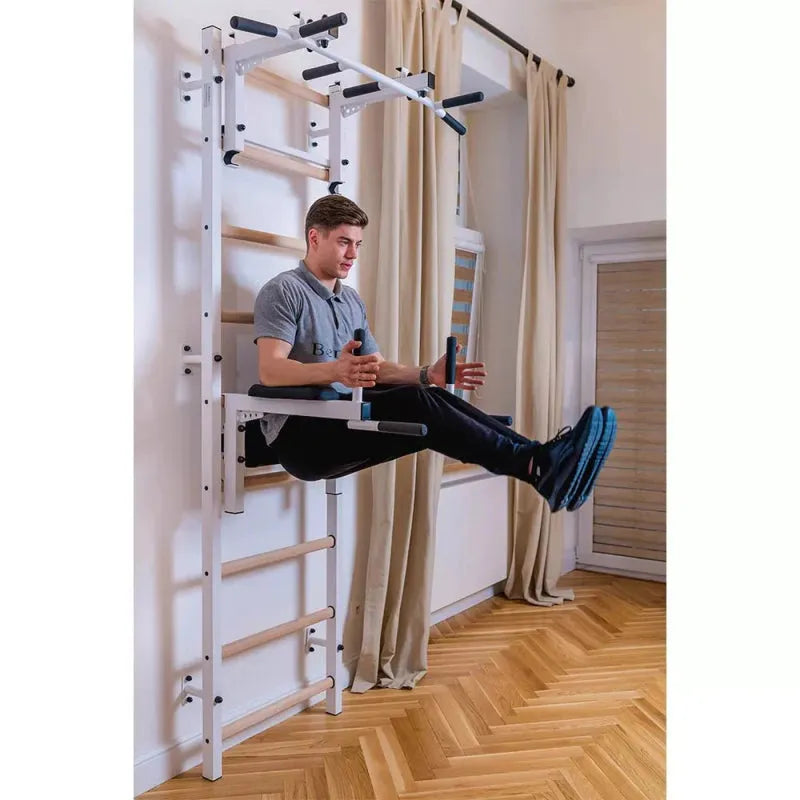 BenchK Stall Bar 732B - Man on leg raise exercise with dip bar