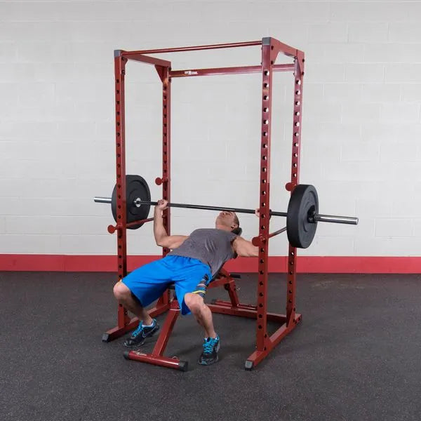 Best Fitness BFPR100 Power Rack - man on adjustable bench and squat rack