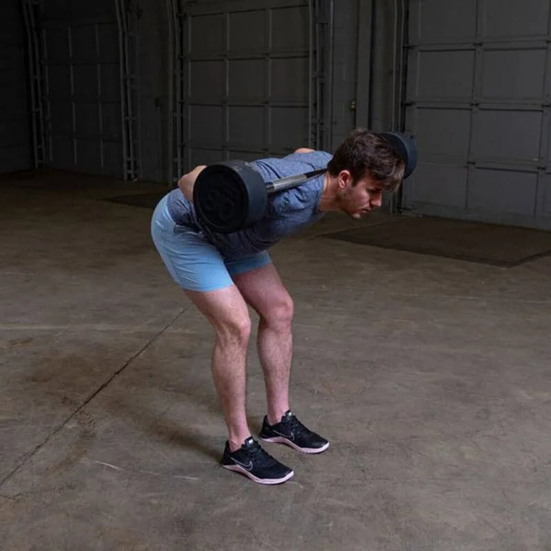 Body-Solid Fixed Straight Bars - Man curl down and barbell lying at the back of his neck