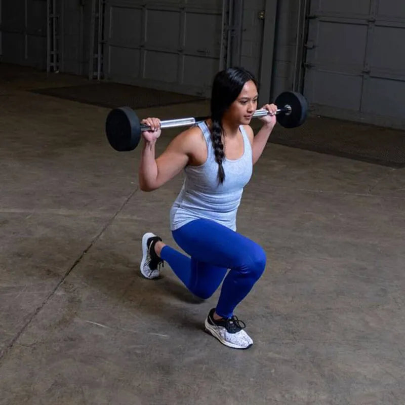 Body-Solid Fixed Straight Bars - Woman kneeling down while barbel at the back