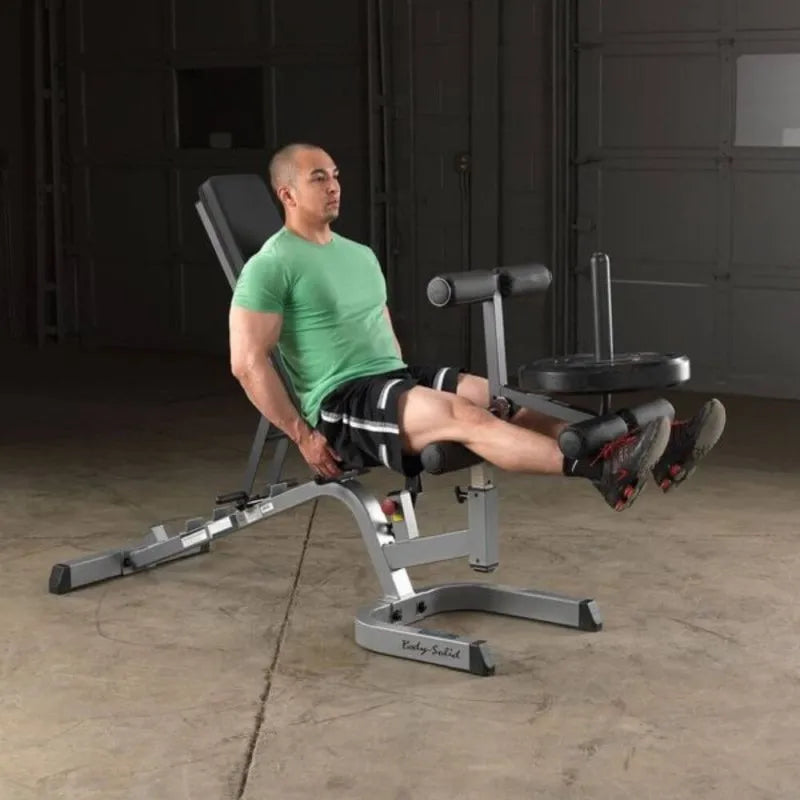 Body-Solid Flat Incline Decline Bench GFID71 - Man in green shirt sitting on bench lifting weights with his legs