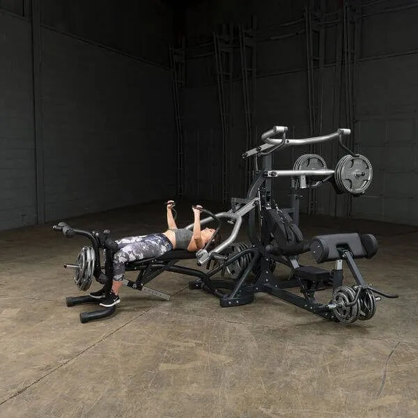 Body-Solid Free Weight Leverage Gym SBL460P4 - woman in bench press training