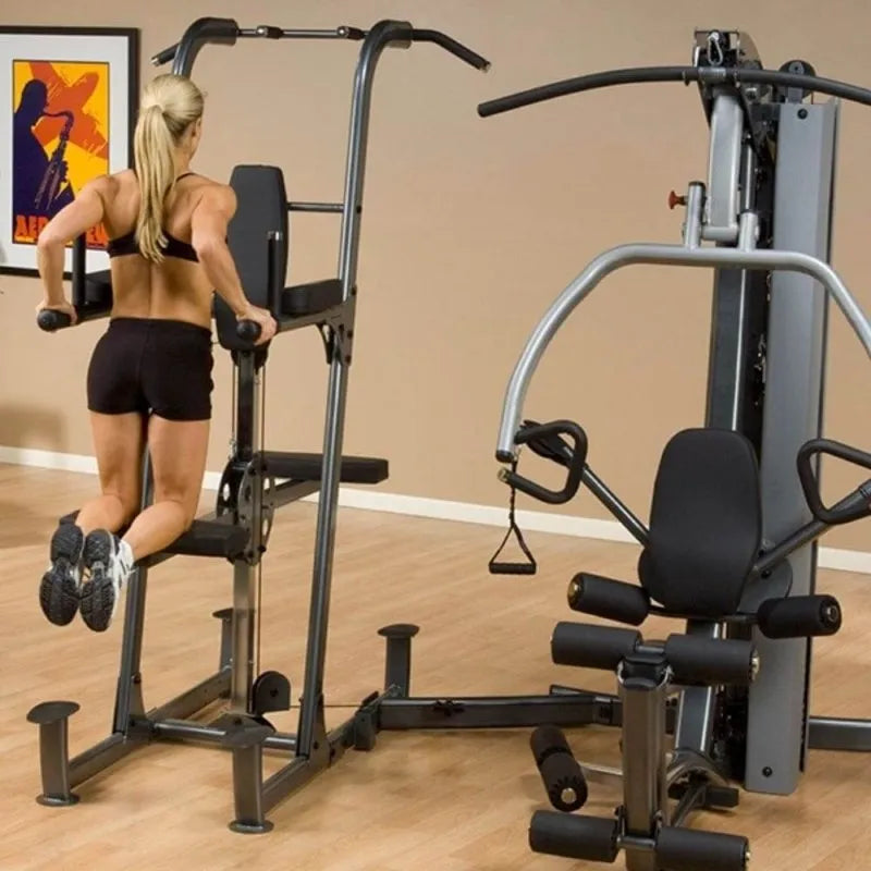 Body-Solid Fusion Weight-Assisted Dip & Pull-Up Station FCDWA - Woman on dips and pull up exercise