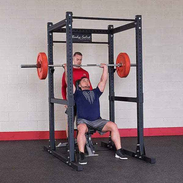 Body Solid Pro Club Line Power Rack Base Rack SPR1000 and Extension - men lifting barbels