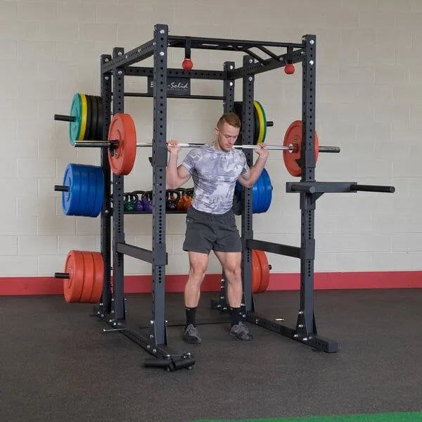 Body Solid Pro Club Line Power Rack Base Rack/Liftoffs/Premium Safeties - man lifting barbel