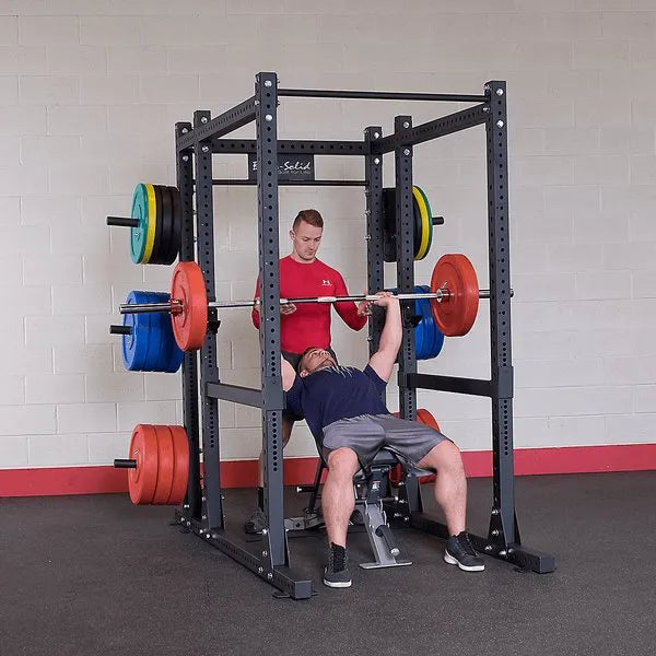 Body Solid Pro Club Line Power Rack Double SPR1000 w. Monkey Bar - men working out on it