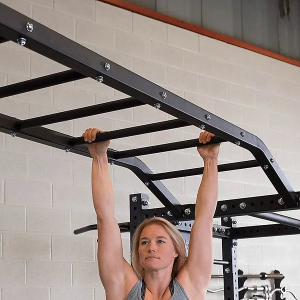 Body Solid Pro Club Line Power Rack Double SPR1000 w. Monkey Bar - woman on monkey bar