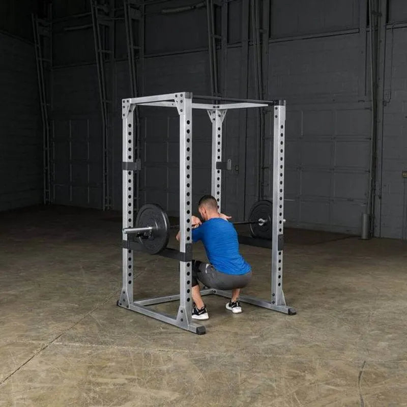Body-Solid Pro Power Rack GPR378 - Man on squat position holding barbell