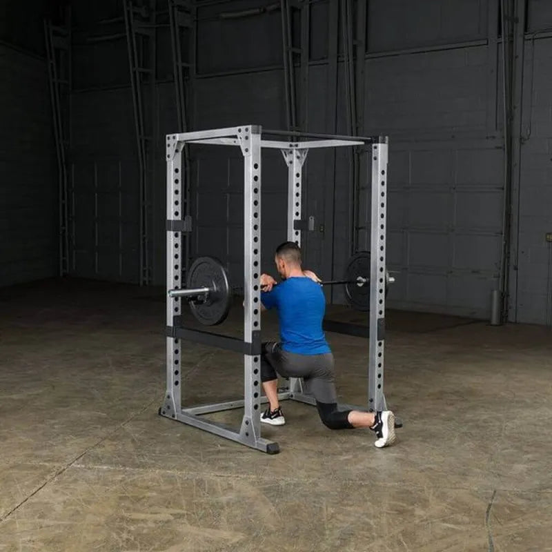 Body-Solid Pro Power Rack GPR378 - Man kneeling down while holding barbell