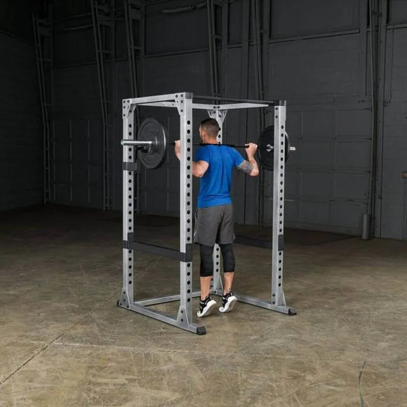 Body-Solid Pro Power Rack GPR378 - Man standing up and barbell rod placed behind his neck