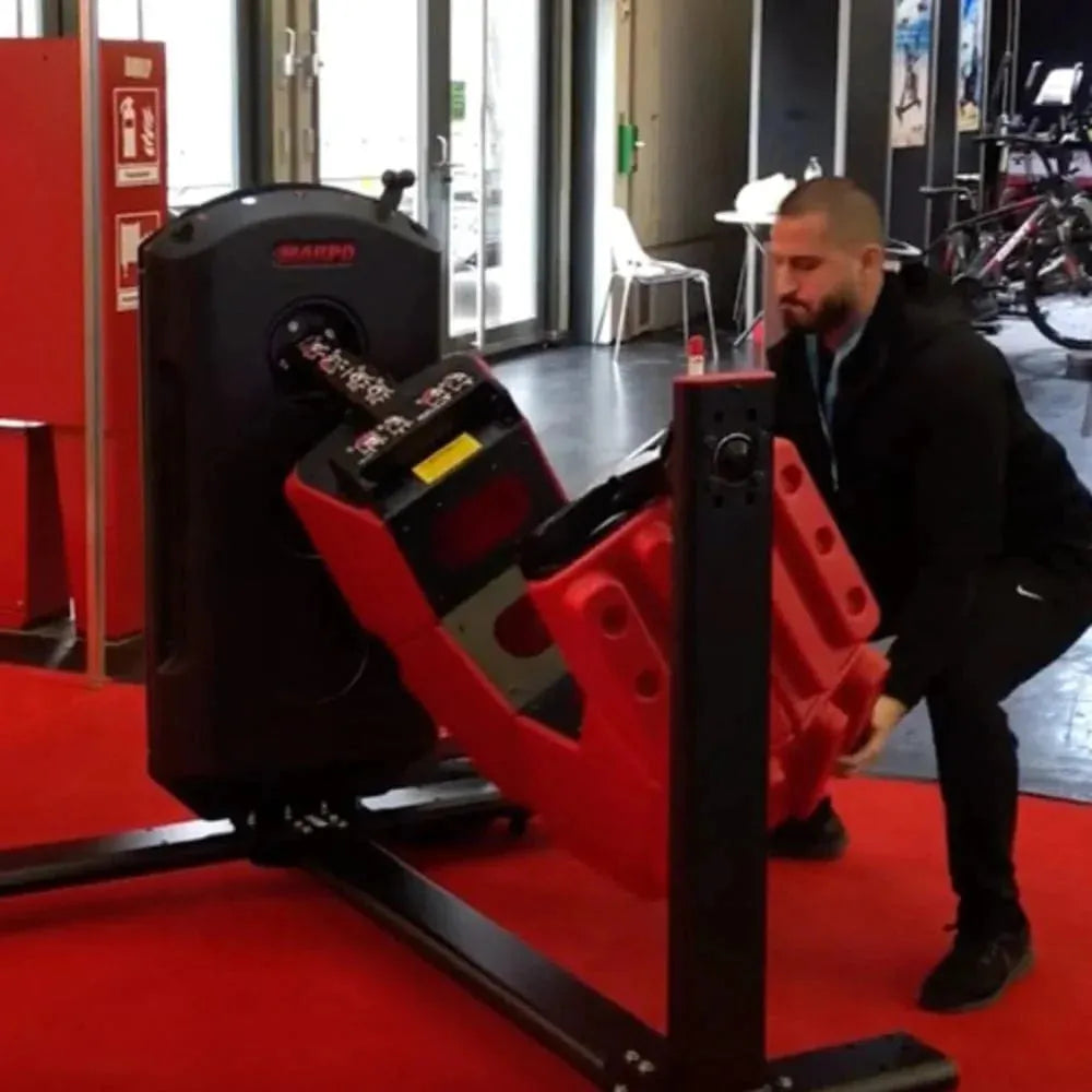 Marpo Tire Flip Machine - Man in suit about to lift the machine