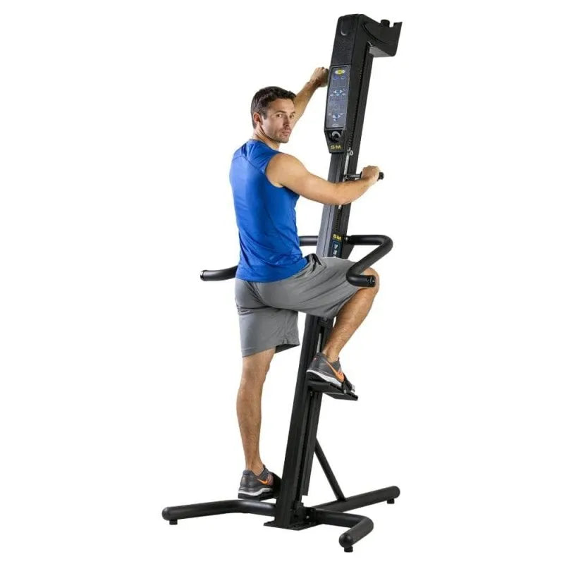 VersaClimber SMA Sport Model Vertical Climber - Male model climbing while looking at the camera