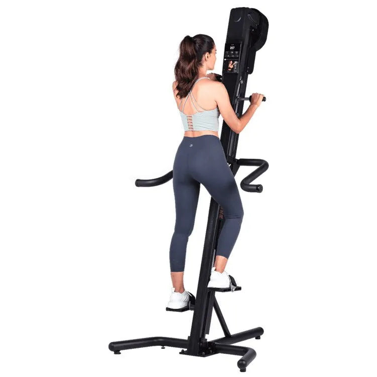 VersaClimber TS-Magnetic Model - Back view of a woman while climbing on machine