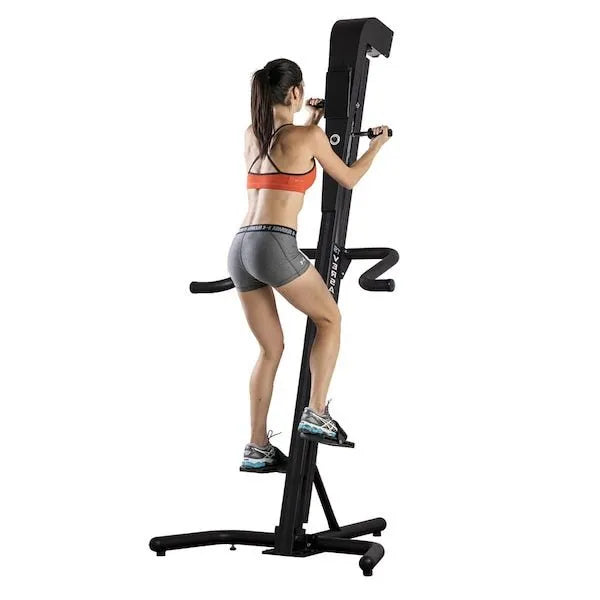 VersaClimber TS-Magnetic Model - a woman on a exercise machine