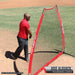 Pro Baseball Coach Jose Alguacil beside a Powernet A-Frame Baseball Pitching Screen Net 1002