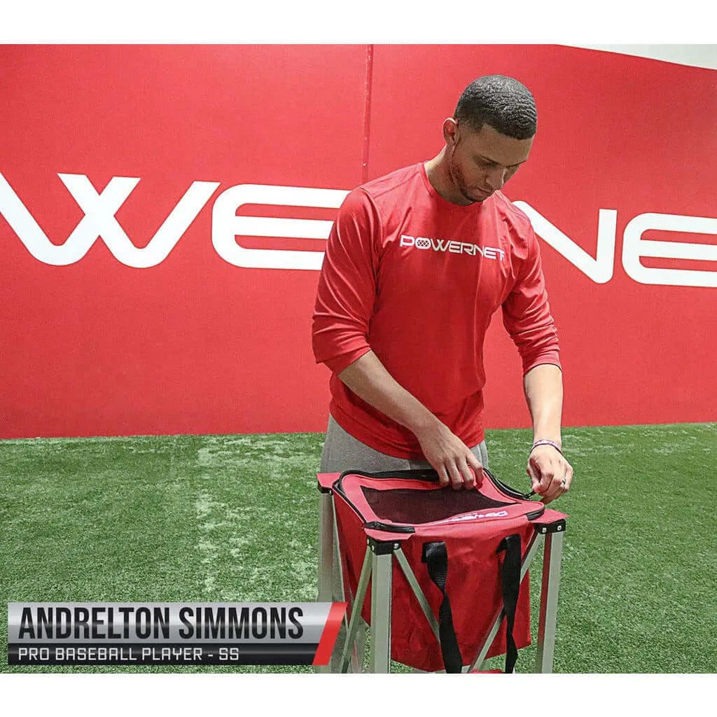 Pro baseball player Andrelton Simmons behind Powernet Wheeled Ball Caddy Cart for Baseball Softball and Tennis 1091