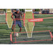 A boy playing soccer is using Powernet Fast Pass Rebounder Soccer Trainer 6x4 FT 1126