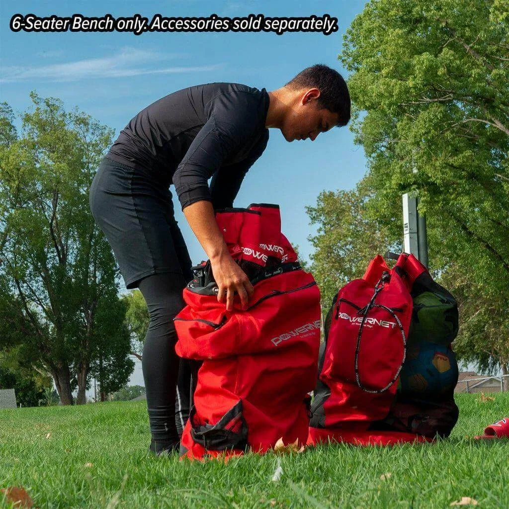 A boy placing Powernet 6-Seater Team Bench 1209 inside a bag