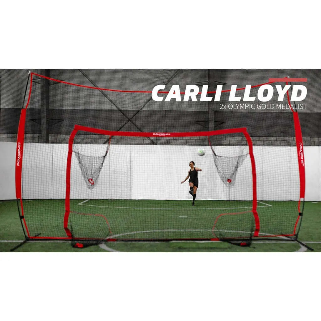 Olympic gold medalist Carli Lloyd playing soccer indoors using Powernet 16x10 Ft Soccer Goal Combo Barrier 1214