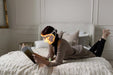 7 Color LED Light Mask - woman reading on the bed wearing the mask 