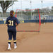 Two girls playing outdoors using Powernet 7x7 FT Pitch-Thru Protection Screen for Softball 49 SQFT Barrier 1090