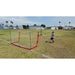 Two children in a field using Powernet Soccer Goal 8x4 Portable Bow Style Net S002 while playing soccer