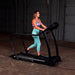 Body-Solid Endurance Walking Treadmill T50 - side view photo of a woman using the treadmill