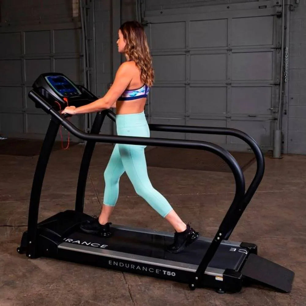 Body-Solid Endurance Walking Treadmill T50 - Other side of the treadmill with a woman on workout
