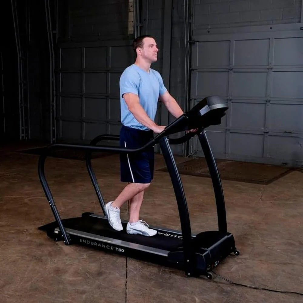 Body-Solid Endurance Walking Treadmill T50 - Man using the treadmill to workout