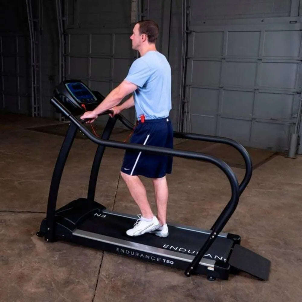 Body-Solid Endurance Walking Treadmill T50 - side view photo of man working out