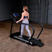 Body-Solid Endurance Walking Treadmill T50 - back photo of a woman using the equipment