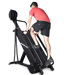 Ropeflex RX4400 APEX Tread Climbing Rope Trainer - A man in a red shirt is climbing a gym equipment