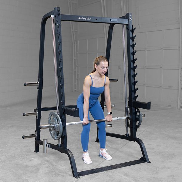 Body-Solid Series 7 Smith Machine - Woman in blue gym clothes working out