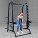 Body-Solid Series 7 Smith Machine - Woman in blue gym clothes working out