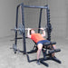 Body-Solid Series 7 Smith Machine - Man lifting weights on smith machine