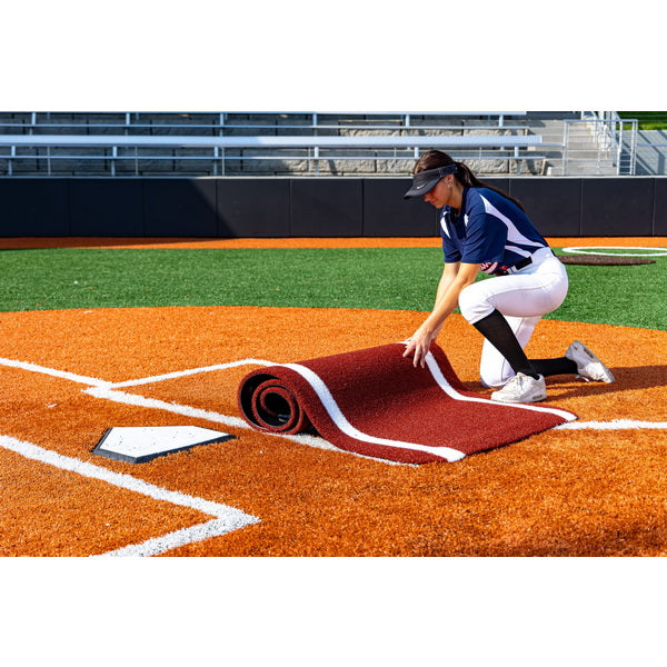 Portolite Half Batter's Mat - woman rolling the mat right side up