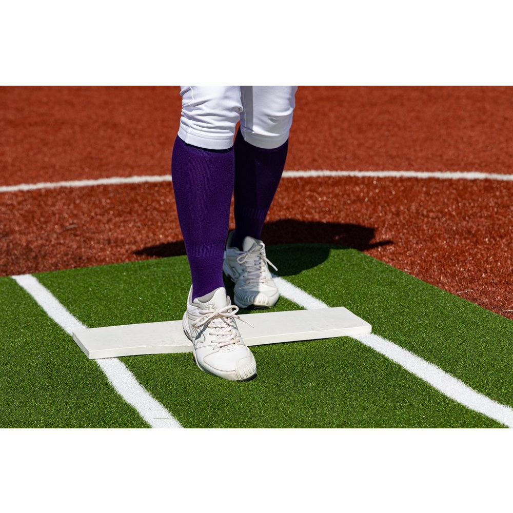 Portolite Pro Softball Pitching Mat with Non Skid Back - someone stepping on mat