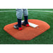 PortoLite 4" Youth Economy Portable Baseball Pitching Mound - man with red shoes standing on it 