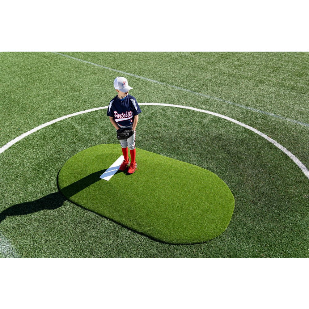 PortoLite 6" Full-Size Baseball Youth League Portable Pitching Mound - with boy standing on it 