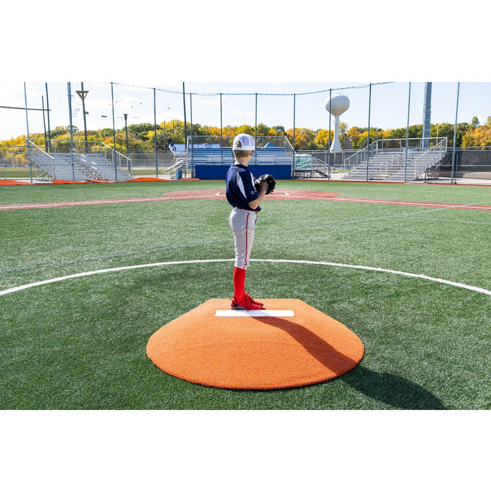 PortoLite 6" Stride Off Portable Youth Pitching Mound For Baseball 7363 - with boy standing on it