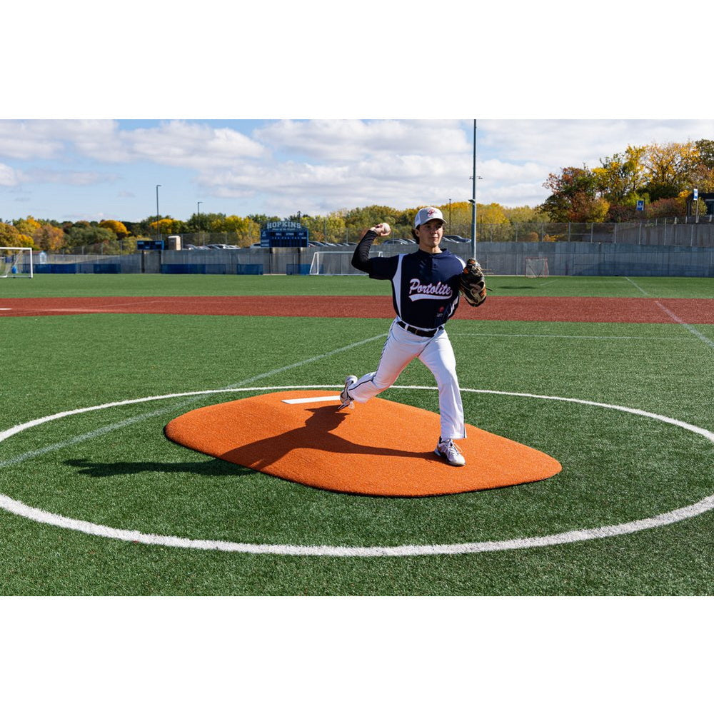 PortoLite 8" Full Length Baseball Portable Pitching Mound - man throwing ball on top of it