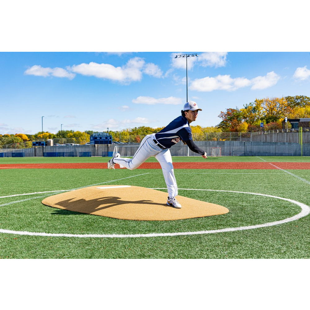 PortoLite Two-Piece 10" Portable Game Mound - player throwing a ball outdoors