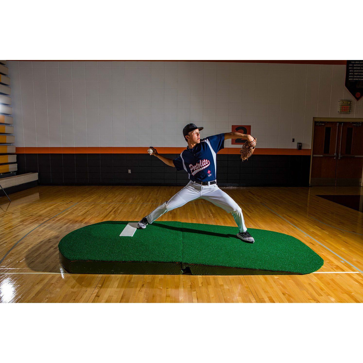 Portolite 10" Two-Piece Oversized Baseball Practice Mound - pitcher using it indoors