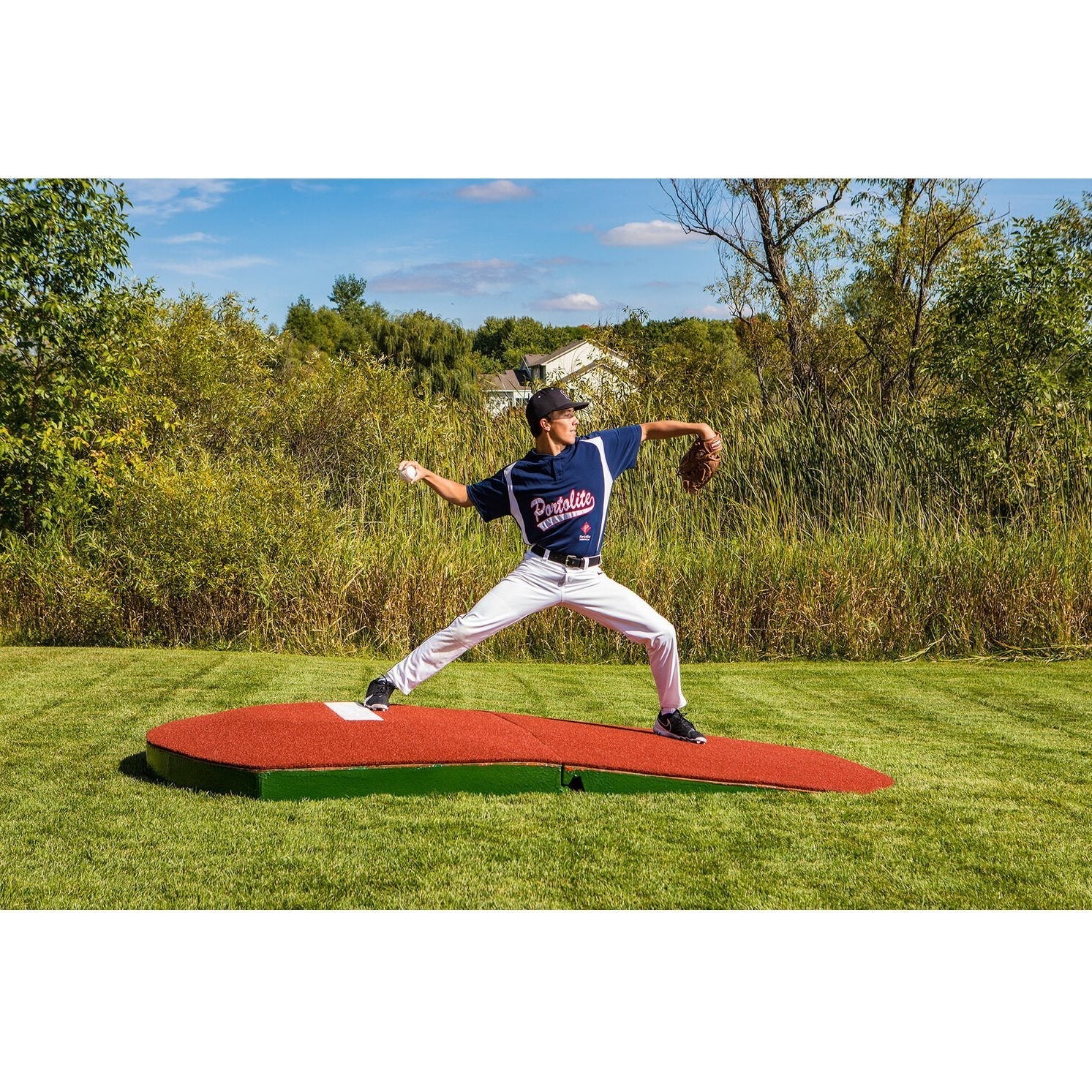 Portolite 10" Two-Piece Oversized Baseball Practice Mound - on a field next to grass