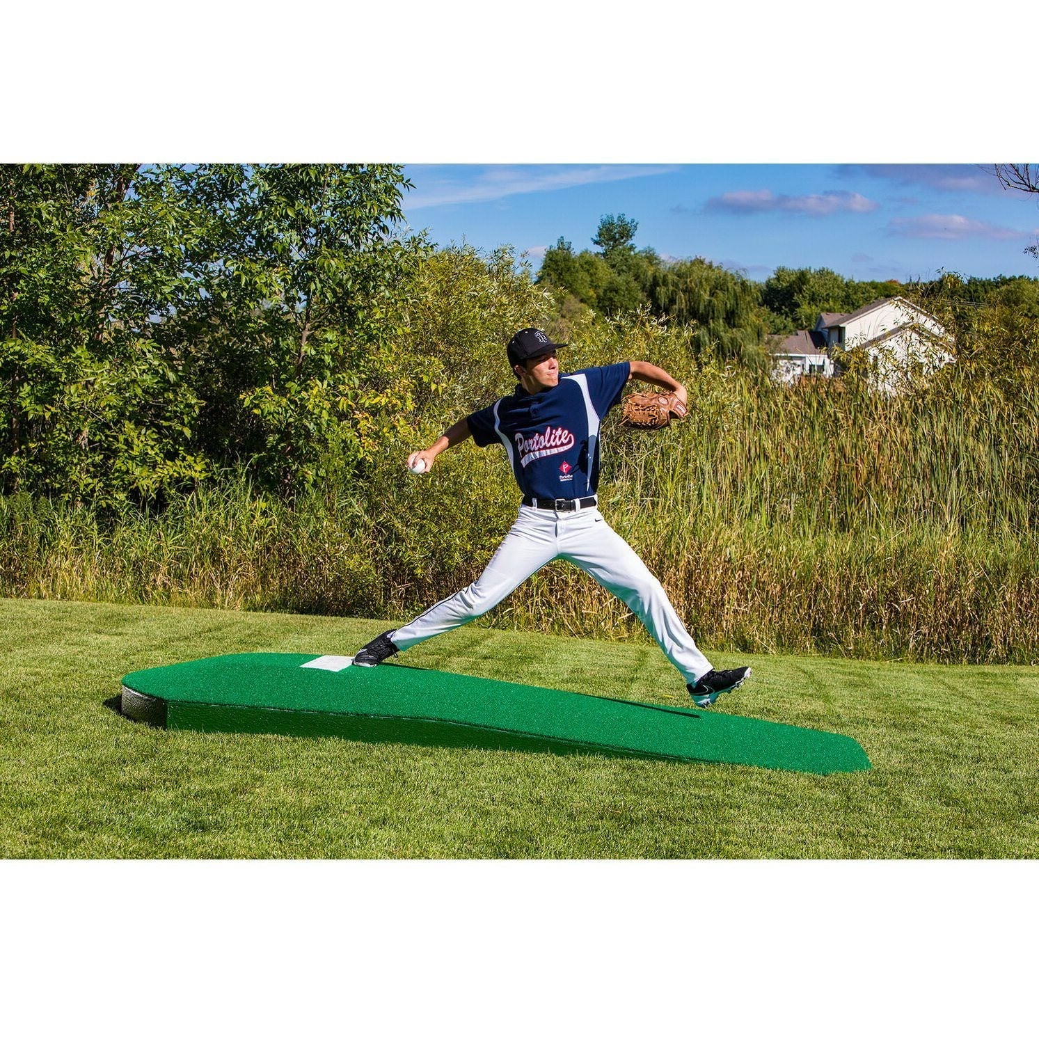 Portolite 10" One-Piece Portable Baseball Practice Pitching Mound 1150 - with man throwing a white ball and holding a glove