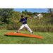 Portolite 10" One-Piece Portable Baseball Practice Pitching Mound 1175 - outdoors with grass and house