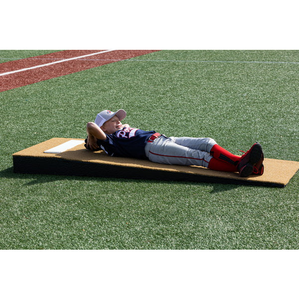 Portolite Jr. Practice Portable Pitching Mound - boy laying down on it 