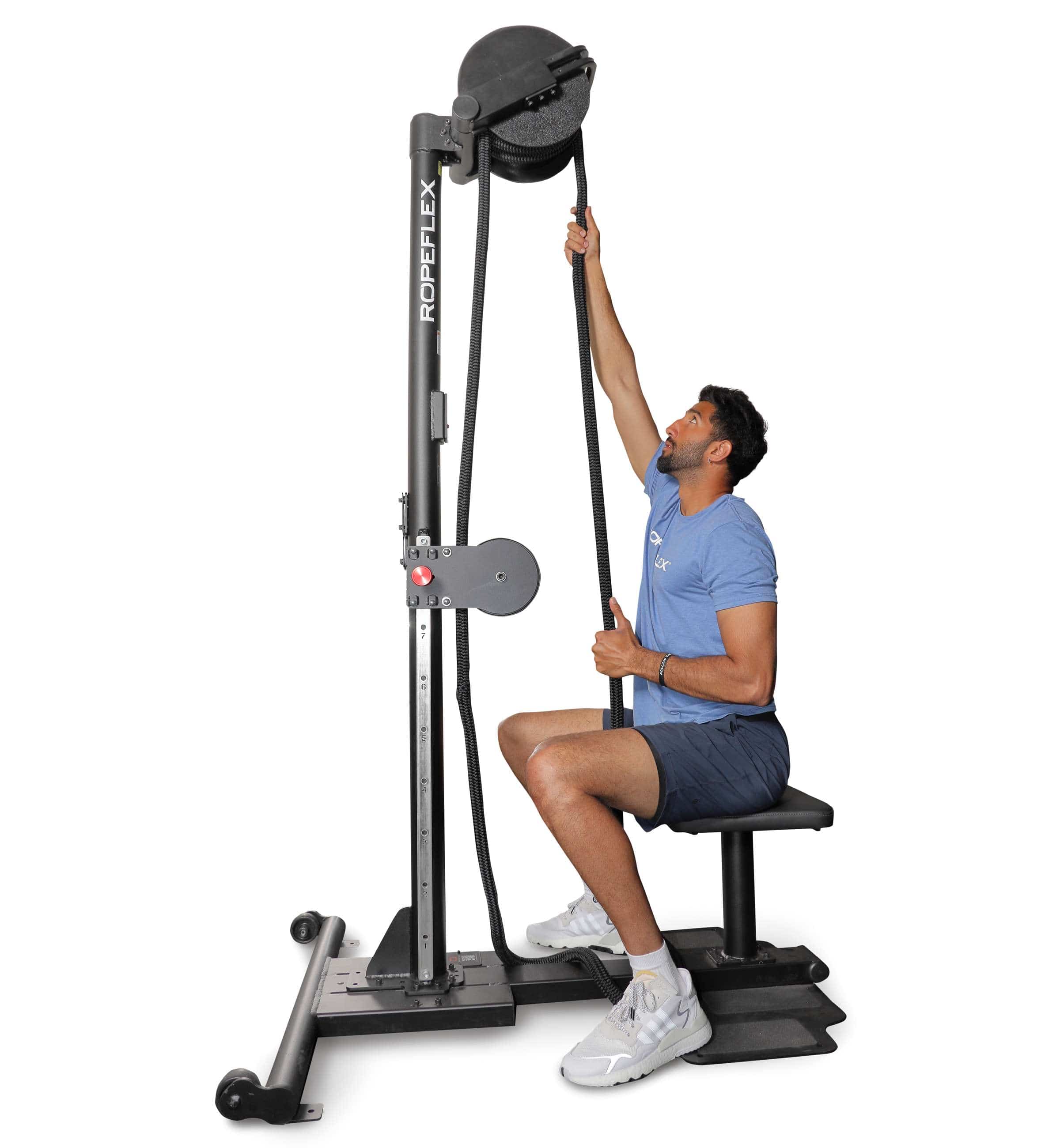 Ropeflex RX2500 ORYX Multi Mode Rope Trainer - man sitting on the machine while pulling rope