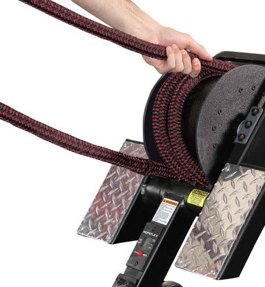 Ropeflex RX3200 ADDAX Rowing Rope Trainer - A hand pulling a thick rope from a workout machine